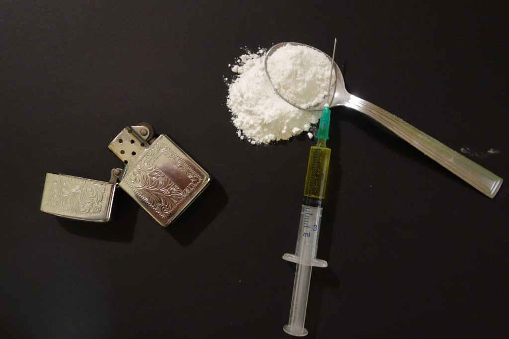 Lighter and drugs on table