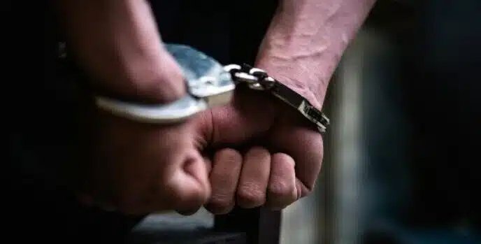 handcuffed person arrested or charged of an offence